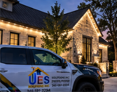 UES Solutions truck in front of a home with permanent roofline lighting