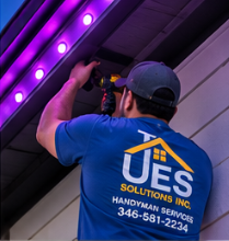 UES Solutions crew installing color-changing LED track under a soffit