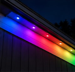 Close-up of color-matched LED track under the eave running a rainbow pattern