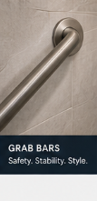 Brushed nickel grab bar in a tiled walk-in shower