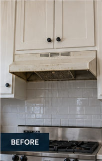 Before range hood installation: dated under-cabinet vent hood with white subway tile